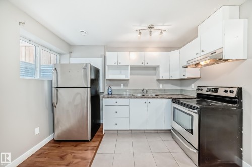 12910 128 Street, Edmonton, AB - Indoor Photo Showing Kitchen With Double Sink