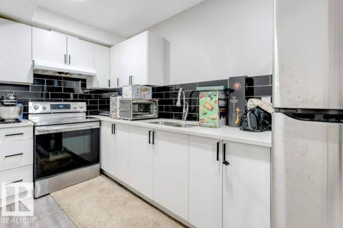 2326 Wonnacott Crescent, Edmonton, AB - Indoor Photo Showing Kitchen With Double Sink