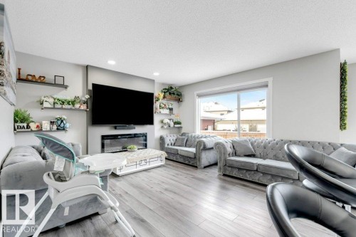 2326 Wonnacott Crescent, Edmonton, AB - Indoor Photo Showing Living Room With Fireplace
