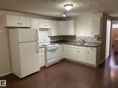 8407 52 Street, Edmonton, AB - Indoor Photo Showing Kitchen With Double Sink