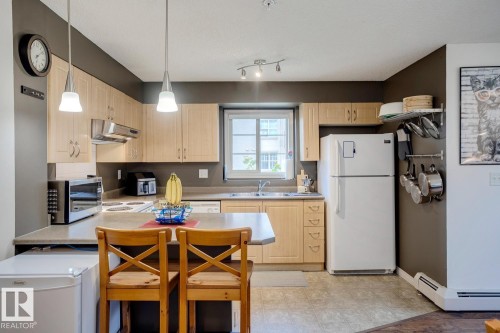 218 11449 Ellerslie Road Sw, Edmonton, AB - Indoor Photo Showing Kitchen With Double Sink