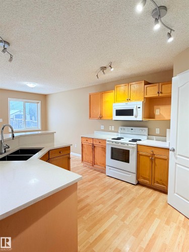 1711 37A Avenue, Edmonton, AB - Indoor Photo Showing Kitchen With Double Sink