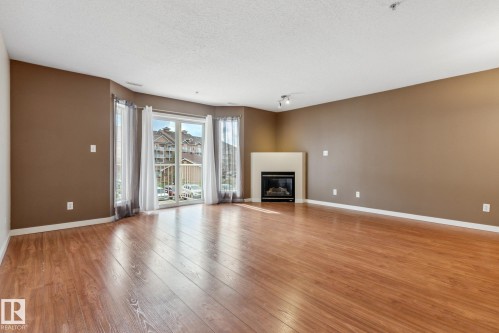 223 4312 139 Avenue, Edmonton, AB - Indoor Photo Showing Living Room With Fireplace
