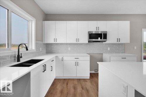 81 Brickyard Drive, Stony Plain, AB - Indoor Photo Showing Kitchen With Double Sink With Upgraded Kitchen