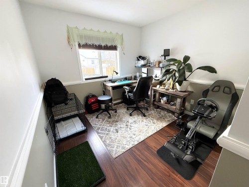 Office space with dark wood-style flooring and baseboards - 62 Willowby Close, Stony Plain, AB - Indoor