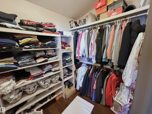 Spacious closet featuring dark wood finished floors - 62 Willowby Close, Stony Plain, AB - Indoor With Storage