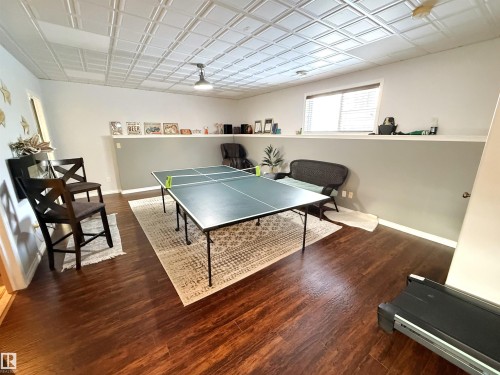 Game room with baseboards and dark wood finished floors - 62 Willowby Close, Stony Plain, AB - Indoor Photo Showing Other Room