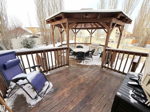 Snow covered deck with a gazebo, a fenced backyard, area for grilling, and outdoor dining space - 62 Willowby Close, Stony Plain, AB - Outdoor With Deck Patio Veranda With Exterior