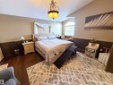 Bedroom featuring lofted ceiling and wood finished floors - 62 Willowby Close, Stony Plain, AB  - Indoor Photo Showing Bedroom 