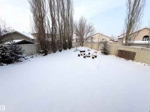 Yard layered in snow featuring a fenced backyard - 62 Willowby Close, Stony Plain, AB - Outdoor