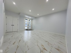 Spare room with light marble finish floors, recessed lighting, and french doors - 