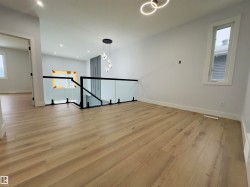 Spare room with light wood-style flooring and recessed lighting - 