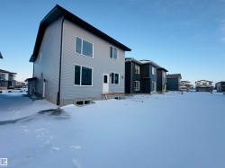 View of snow covered rear of property - 