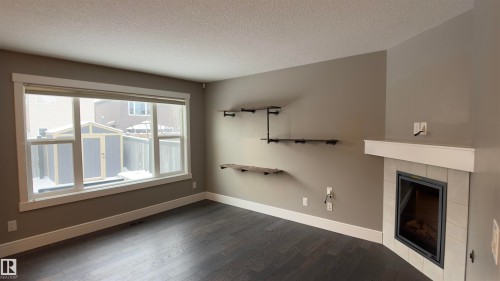 616 175A Street Sw, Edmonton, AB - Indoor Photo Showing Other Room With Fireplace