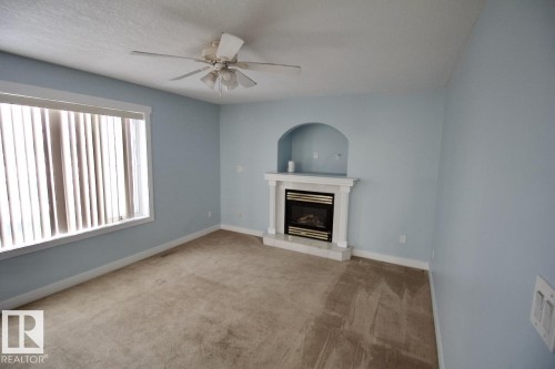 2206 Kaufman Way, Edmonton, AB - Indoor Photo Showing Living Room With Fireplace