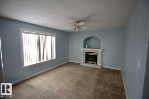 2206 Kaufman Way, Edmonton, AB - Indoor Photo Showing Living Room With Fireplace