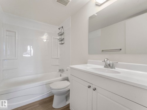 new tub surround, flooring and vanity - 406 10125 109 Street, Edmonton, AB - Indoor Photo Showing Bathroom
