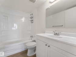 new tub surround, flooring and vanity - 