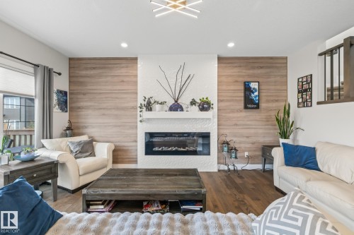 568 Merlin Landing Landing, Edmonton, AB - Indoor Photo Showing Living Room With Fireplace