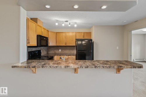 313 11615 Ellerslie Road, Edmonton, AB - Indoor Photo Showing Kitchen With Upgraded Kitchen