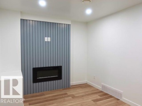 11912 140 Avenue, Edmonton, AB - Indoor Photo Showing Other Room With Fireplace
