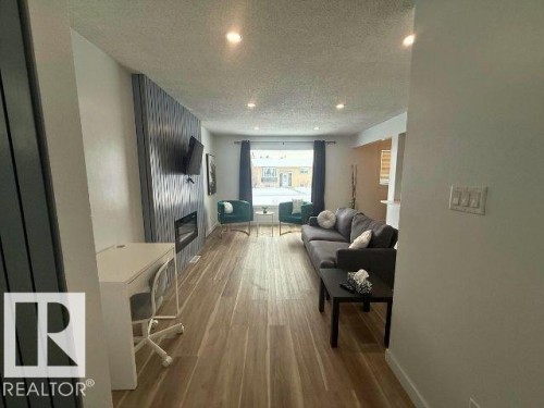 11912 140 Avenue, Edmonton, AB - Indoor Photo Showing Other Room With Fireplace