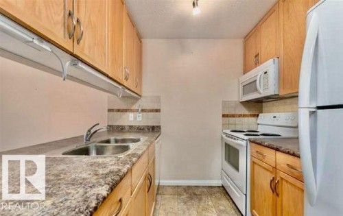 208 1204 156 Street, Edmonton, AB - Indoor Photo Showing Kitchen With Double Sink