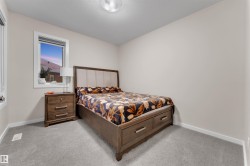 Bedroom featuring carpet flooring and a textured ceiling - 