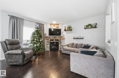 8209 14 Avenue, Edmonton, AB - Indoor Photo Showing Living Room With Fireplace