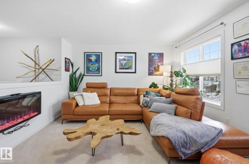 8209 14 Avenue, Edmonton, AB - Indoor Photo Showing Living Room With Fireplace