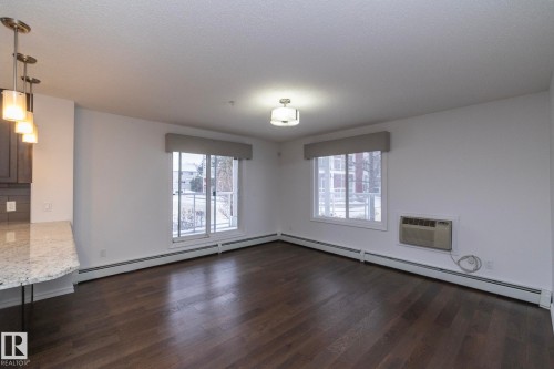 102 2203 44 Avenue, Edmonton, AB - Indoor With Fireplace