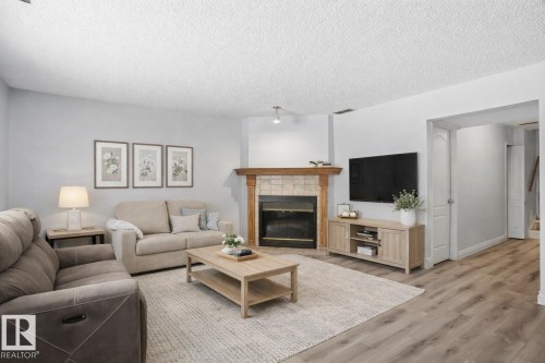 3623 24 Avenue, Edmonton, AB - Indoor Photo Showing Living Room With Fireplace