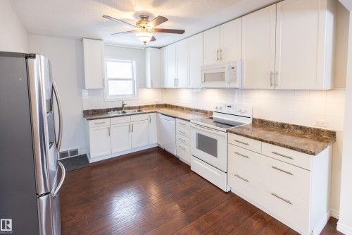 8335 76 Avenue, Edmonton, AB - Indoor Photo Showing Kitchen With Double Sink