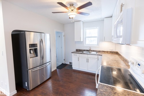 8335 76 Avenue, Edmonton, AB - Indoor Photo Showing Kitchen With Double Sink
