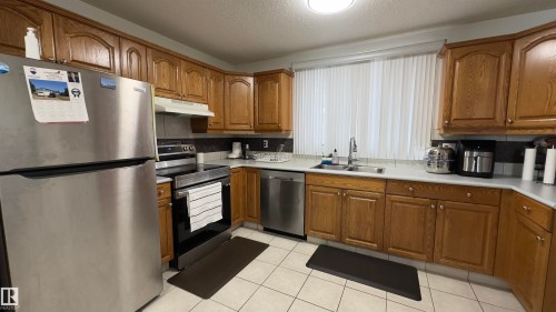 15024 55 Street, Edmonton, AB - Indoor Photo Showing Kitchen With Double Sink