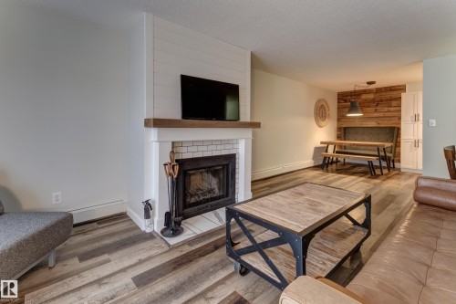 404 10420 93 Street, Edmonton, AB - Indoor Photo Showing Living Room With Fireplace