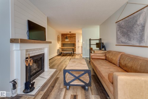 404 10420 93 Street, Edmonton, AB - Indoor Photo Showing Living Room With Fireplace