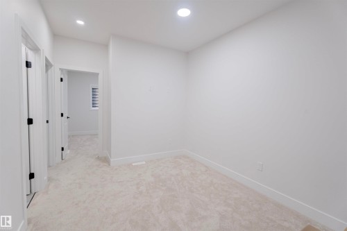 Unfurnished room with light colored carpet and recessed lighting - 244 Rolston Wynd, Leduc, AB - Indoor Photo Showing Other Room