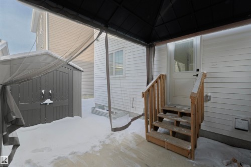 Entrance to property featuring a patio area - 244 Rolston Wynd, Leduc, AB - Outdoor With Exterior