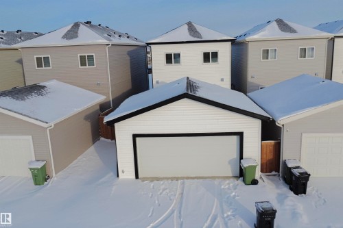 View of front of property featuring a garage - 244 Rolston Wynd, Leduc, AB - Outdoor With Exterior