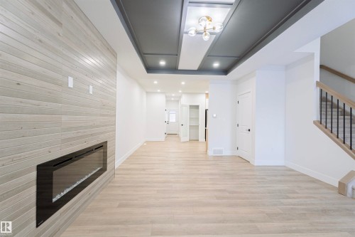 244 Rolston Wynd, Leduc, AB - Indoor Photo Showing Other Room With Fireplace