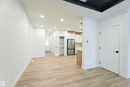 Empty room with recessed lighting and light wood-style floors - 244 Rolston Wynd, Leduc, AB - Indoor Photo Showing Other Room