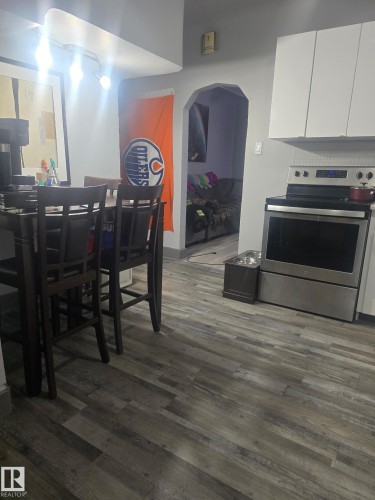 Dining space with dark wood finished floors - 11516 88 Street, Edmonton, AB - Indoor