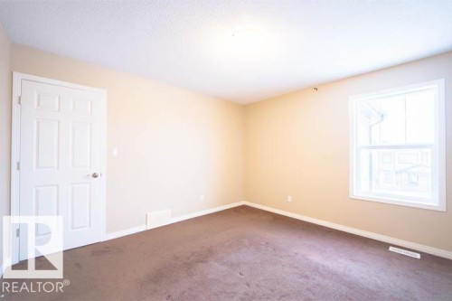 Spare room featuring carpet flooring and baseboards - 3117 Arthurs Crescent, Edmonton, AB - Indoor Photo Showing Other Room