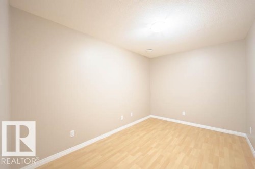 Empty room with baseboards and light wood-style floors - 3117 Arthurs Crescent, Edmonton, AB - Indoor Photo Showing Other Room