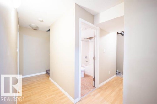 Hallway with light wood-style floors - 3117 Arthurs Crescent, Edmonton, AB - Indoor