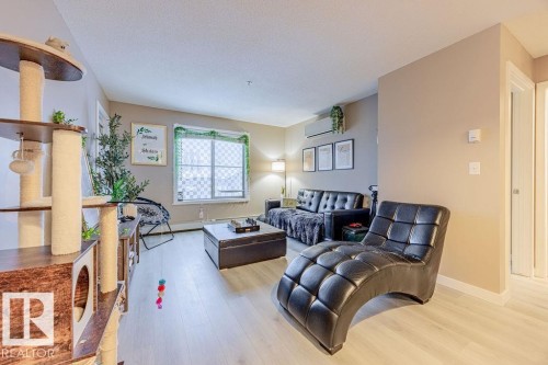 310 12025 22 Avenue, Edmonton, AB - Indoor Photo Showing Living Room