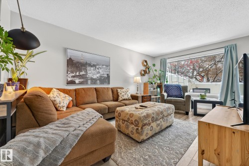 Living room featuring a textured ceiling and wood finished floors - 7 Grandview Ridge, St. Albert, AB - Indoor Photo Showing Living Room