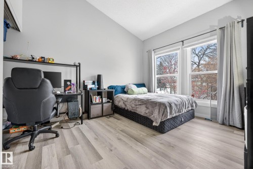 Bedroom featuring lofted ceiling, light wood-type flooring, and a desk - 7 Grandview Ridge, St. Albert, AB - Indoor Photo Showing Bedroom