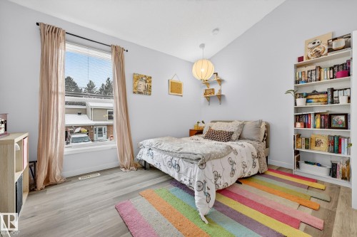 Bedroom with lofted ceiling and light wood-style flooring - 7 Grandview Ridge, St. Albert, AB - Indoor Photo Showing Bedroom
